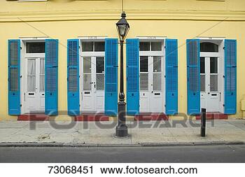Stock Photography - 'blue shutter 
and lamp post 
in french quarter 
near bourbon street 
in. fotosearch 
- search stock 
photos, pictures, 
images, and photo 
clipart