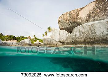 Stock Image - british virgin 
islands, granite 
boulders bordering 
sea, surface view. 
fotosearch - search 
stock photos, 
pictures, images, 
and photo clipart