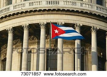 Picture - 'the capitolio 
and cuban flag, 
 the cuban capitol 
building and dome. 
fotosearch - search 
stock photos, 
pictures, images, 
and photo clipart