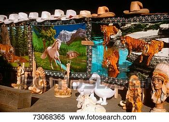 Stock Image - 'carpets,  cowboy 
hats and ceramics 
for sale at a 
roadside stand. 
fotosearch - search 
stock photos, 
pictures, images, 
and photo clipart