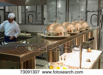 Picture - chef preparing 
food in hotel 
kitchen. fotosearch 
- search stock 
photos, pictures, 
images, and photo 
clipart