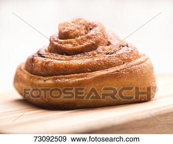 Stock Photograph - cinnamon roll, 
side view, close-up. 
fotosearch - search 
stock photos, 
pictures, images, 
and photo clipart