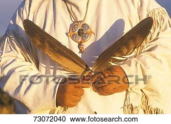 Stock Photography - 'close-up of a 
native american 
holding ceremonial 
feathers,  big 
sur. fotosearch 
- search stock 
photos, pictures, 
images, and photo 
clipart
