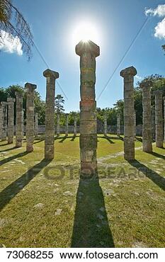 Stock Image - 'columns surrounding 
grassy courtyard 
for ballgames 
at chichen itza. 
fotosearch - search 
stock photos, 
pictures, images, 
and photo clipart