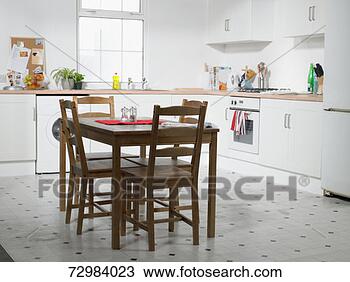 Stock Photo - domestic kitchen 
with table and 
chairs. fotosearch 
- search stock 
photos, pictures, 
images, and photo 
clipart