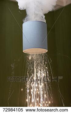 Stock Image - domestic light 
bulb in lampshade 
exploding. fotosearch 
- search stock 
photos, pictures, 
images, and photo 
clipart