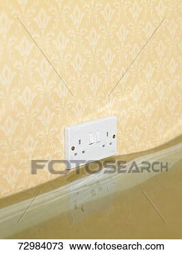Stock Photo - electric wall 
outlet reflected 
in water in flooded 
living room. fotosearch 
- search stock 
photos, pictures, 
images, and photo 
clipart