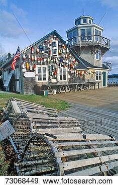 Stock Photograph - 'floats from fishing 
nets hang on the 
side of a lighthouse 
in. fotosearch 
- search stock 
photos, pictures, 
images, and photo 
clipart