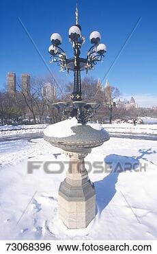 Stock Photo - 'fountain with 
snow in central 
park,  manhattan, 
 new york city, 
 ny. fotosearch 
- search stock 
photos, pictures, 
images, and photo 
clipart