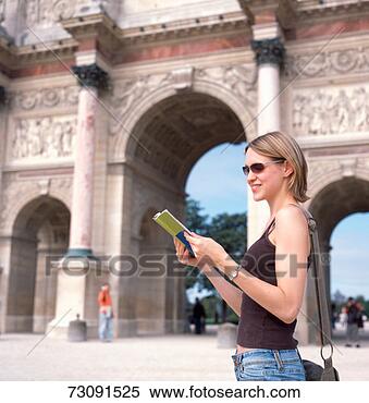 Stock Image - france, paris, 
louvre, young 
woman reading 
book, side view. 
fotosearch - search 
stock photos, 
pictures, images, 
and photo clipart