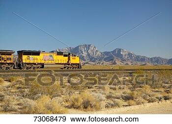 Stock Photograph - freight train 
travels through 
desert and mountainous 
areas of mojave. 
fotosearch - search 
stock photos, 
pictures, images, 
and photo clipart