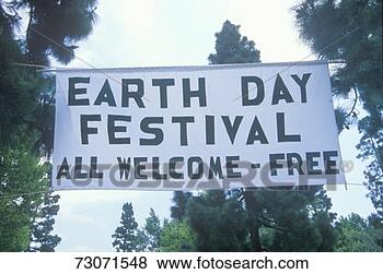 Stock Photo - a hanging sign 
welcoming people 
to the earth day 
festival. fotosearch 
- search stock 
photos, pictures, 
images, and photo 
clipart