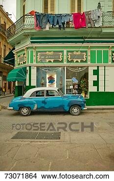 Stock Photo - 'laundry hanging 
out on balcony 
overlooking old 
car in old havana. 
fotosearch - search 
stock photos, 
pictures, images, 
and photo clipart