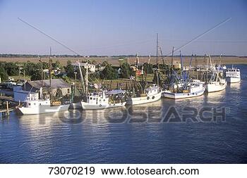 Stock Photograph - a line of shrimp 
fishing boats 
in the intercoastal 
waterway in. fotosearch 
- search stock 
photos, pictures, 
images, and photo 
clipart