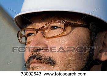 Stock Photo - man wearing white 
hat and glasses 
looking out. fotosearch 
- search stock 
photos, pictures, 
images, and photo 
clipart