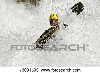 Stock Photo - man white-water 
kayaking surrounded 
by spray. fotosearch 
- search stock 
photos, pictures, 
images, and photo 
clipart