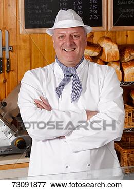 Picture - master baker posing 
in bakery, portrait. 
fotosearch - search 
stock photos, 
pictures, images, 
and photo clipart