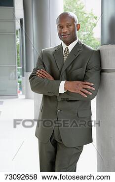 Stock Photo - mature business 
man leaning against 
pillar, portrait. 
fotosearch - search 
stock photos, 
pictures, images, 
and photo clipart