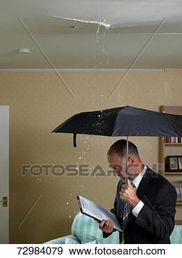 Stock Photograph - mature man in 
suit with clipboard 
holding umbrella 
under water. fotosearch 
- search stock 
photos, pictures, 
images, and photo 
clipart