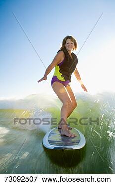 Picture - mature woman wake 
surfing. fotosearch 
- search stock 
photos, pictures, 
images, and photo 
clipart