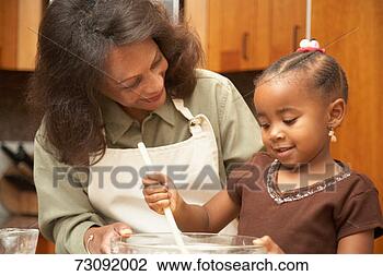 Stock Photo - mother and daughter 
(3-5) in kitchen, 
mixing ingredients 
in bowl. fotosearch 
- search stock 
photos, pictures, 
images, and photo 
clipart