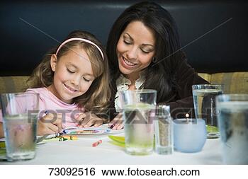 Stock Photo - mother watching 
daughter (6-8) 
crayoning picture 
at dining table. 
fotosearch - search 
stock photos, 
pictures, images, 
and photo clipart