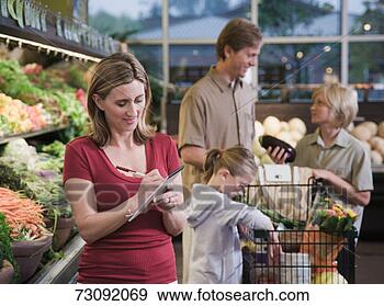 Stock Photograph - mother writing 
on pad, family 
filling trolley. 
fotosearch - search 
stock photos, 
pictures, images, 
and photo clipart