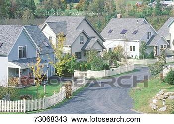 Stock Photo - new england neighborhood 
with white picket 
fences. fotosearch 
- search stock 
photos, pictures, 
images, and photo 
clipart
