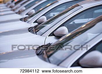 Stock Photo - new silver cars 
in a row, close-up. 
fotosearch - search 
stock photos, 
pictures, images, 
and photo clipart
