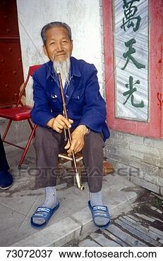 Picture - 'old man with 
pipe in dali, 
 yunnan province, 
 people's republic 
of. fotosearch 
- search stock 
photos, pictures, 
images, and photo 
clipart