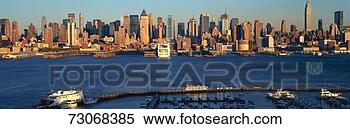 Stock Image - 'panoramic view 
of midtown manhattan, 
 ny skyline with 
hudson river. 
fotosearch - search 
stock photos, 
pictures, images, 
and photo clipart