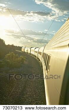 Stock Photo - passenger train 
traveling into 
the arizona sunset. 
fotosearch - search 
stock photos, 
pictures, images, 
and photo clipart
