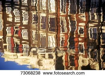 Stock Photo - 'reflections of 
buildings in a 
canal in amsterdam, 
holland'. fotosearch 
- search stock 
photos, pictures, 
images, and photo 
clipart