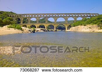 Picture - 'river gard and 
the pont du gard, 
nimes, france'. 
fotosearch - search 
stock photos, 
pictures, images, 
and photo clipart