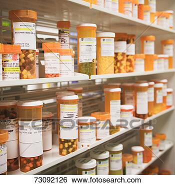 Stock Photo - rows of pill bottles 
on shelves in 
pharmacy, differential 
focus. fotosearch 
- search stock 
photos, pictures, 
images, and photo 
clipart