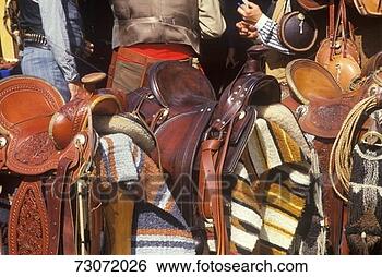 Stock Photo - 'saddles and blankets 
during cowboy 
reenactment, ca'. 
fotosearch - search 
stock photos, 
pictures, images, 
and photo clipart