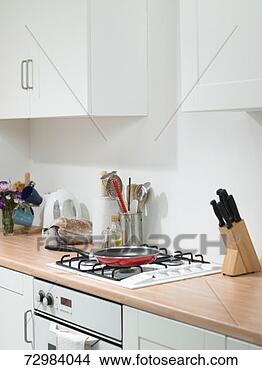 Stock Photo - section of domestic 
kitchen with frying 
pan on hob. fotosearch 
- search stock 
photos, pictures, 
images, and photo 
clipart