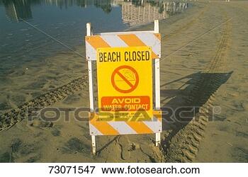 Picture - 'a sign reading 
 avoid water contact 
 warning people 
that a beach at. 
fotosearch - search 
stock photos, 
pictures, images, 
and photo clipart
