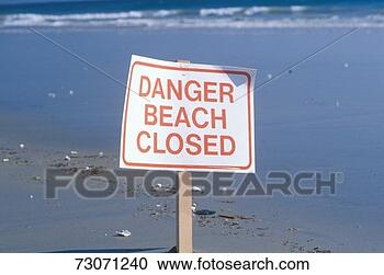 Stock Photography - a sign reads danger 
beach closed. 
fotosearch - search 
stock photos, 
pictures, images, 
and photo clipart