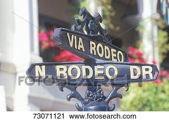 Stock Photography - a sign that reads 
 via rodeo/n rodeo 
dr . fotosearch 
- search stock 
photos, pictures, 
images, and photo 
clipart