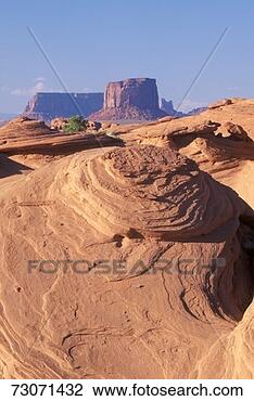 Stock Photo - 'swirling sandstone 
rock formation, 
monument valley, 
arizona'. fotosearch 
- search stock 
photos, pictures, 
images, and photo 
clipart