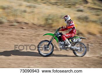 Stock Photo - teenage boy (14-15) 
riding motocross 
motorcycle on 
dirt track. fotosearch 
- search stock 
photos, pictures, 
images, and photo 
clipart
