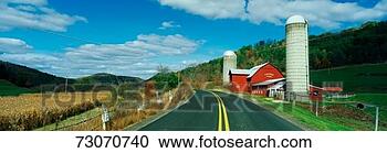 Stock Photography - this is a country 
road with a farm 
on the right hand 
side of the road. 
fotosearch - search 
stock photos, 
pictures, images, 
and photo clipart