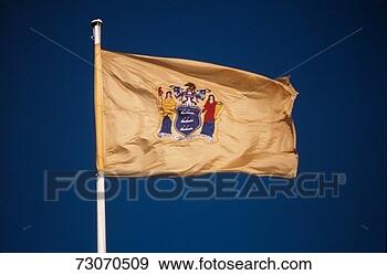Stock Photograph - 'this is the new 
jersey state flag 
situated on a 
flagpole,  waving 
in. fotosearch 
- search stock 
photos, pictures, 
images, and photo 
clipart