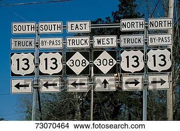 Stock Photo - this is a set 
of road signs 
offering directions 
at a fork in the 
road. fotosearch 
- search stock 
photos, pictures, 
images, and photo 
clipart