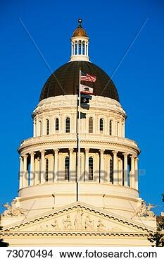 Stock Photo - 'this is the state 
capitol dome at 
sunset it has 
several flags 
waving. fotosearch 
- search stock 
photos, pictures, 
images, and photo 
clipart