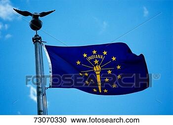 Stock Photography - this is the state 
flag waving in 
the wind it is 
on a flagpole 
against. fotosearch 
- search stock 
photos, pictures, 
images, and photo 
clipart