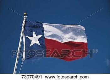 Stock Photography - this is the state 
flag flying in 
the wind it is 
on a flagpole 
against. fotosearch 
- search stock 
photos, pictures, 
images, and photo 
clipart