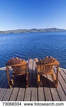 Stock Photo - 'two adirondack 
chairs on a deck 
overlooking lake 
george, ny'. fotosearch 
- search stock 
photos, pictures, 
images, and photo 
clipart