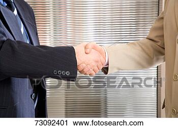 Stock Photography - two businessmen 
shaking hands, 
mid section. fotosearch 
- search stock 
photos, pictures, 
images, and photo 
clipart